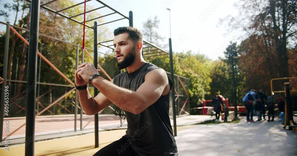 Sporty man doing lunges on one leg to strengthen the muscles of the thighs and buttocks. Healthy lifestyle and outdoor training. Man exercising for outdoor warm-up. sitting exercises for the legs. Sporty man doing lunges on one leg to strengthen the muscles of the thighs and buttocks. Healthy lifestyle and outdoor training. Man exercising for outdoor warm-up. sitting exercises for the legs.