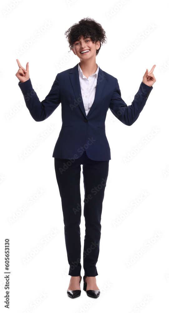 Beautiful businesswoman in suit pointing at something on white background Beautiful businesswoman in suit pointing at something on white background