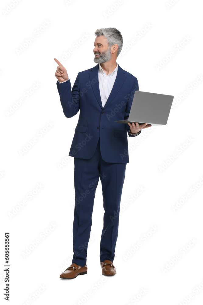 Mature businessman in stylish clothes with laptop on white background