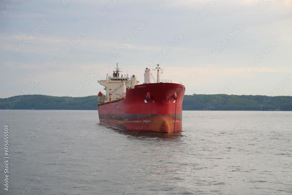Large red bulk carrier (cargo ship) sailing in the Baltic sea.