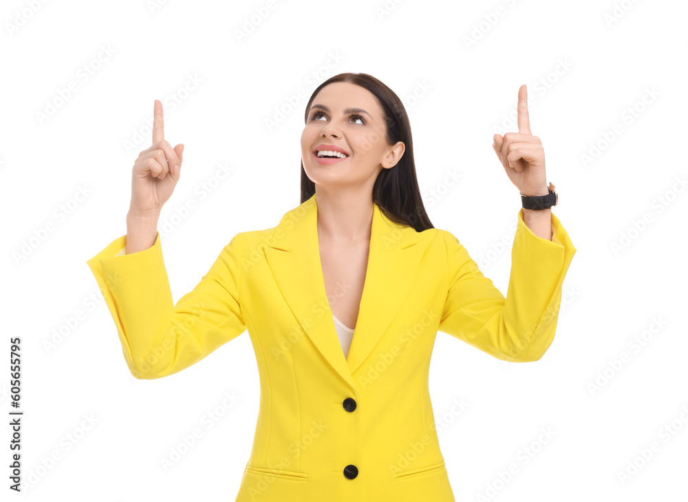 Beautiful happy businesswoman in yellow suit pointing at something on white background Beautiful happy businesswoman in yellow suit pointing at something on white background