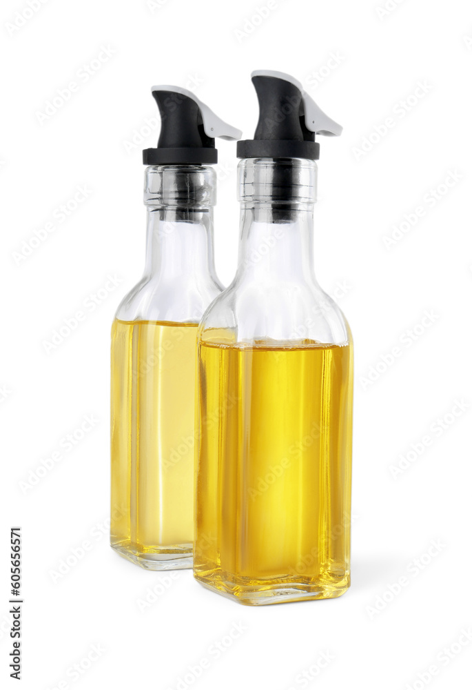 Glass bottles with cooking oil on white background Glass bottles with cooking oil on white background