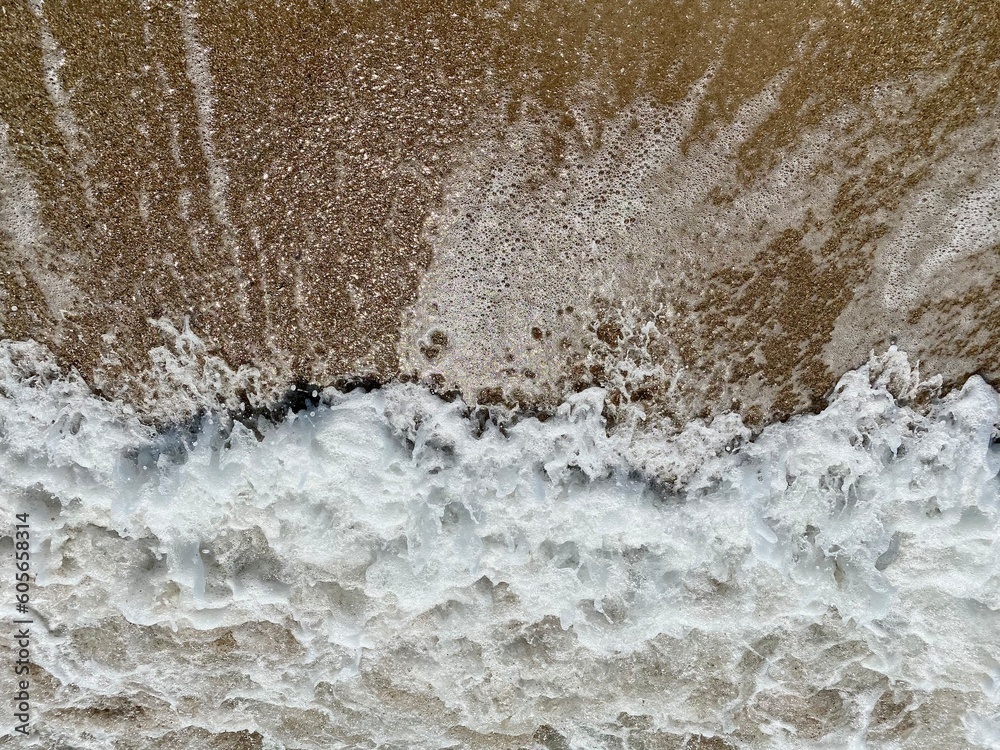 close-up of flowing water, rapid water splashes of an white water river or stream, bubbly water