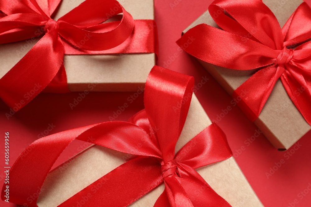 Beautiful gift boxes on red background, closeup