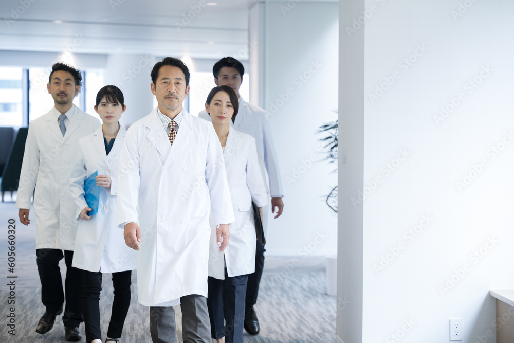 Image of multiple doctors and researchers where they all walk in a set ...