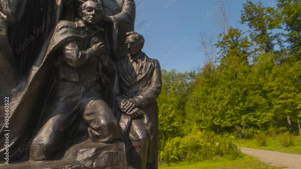 tilt up to a statue representing the restoration of the priesthood by Peter James ,John laying hands on Joseph Smith's head, Oliver Cowdery's head. Mormons or Church of Jesus Christ Latter-day Saints tilt up to a statue representing the restoration of the priesthood by Peter James ,John laying hands on Joseph Smith's head, Oliver Cowdery's head. Mormons or Church of Jesus Christ Latter-day Saints