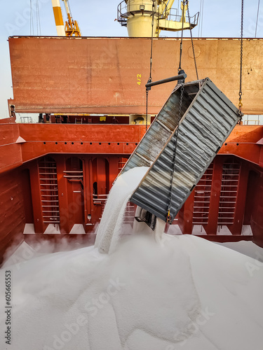 Fertilizers were loading into a cargo hold off a bulk carrier 