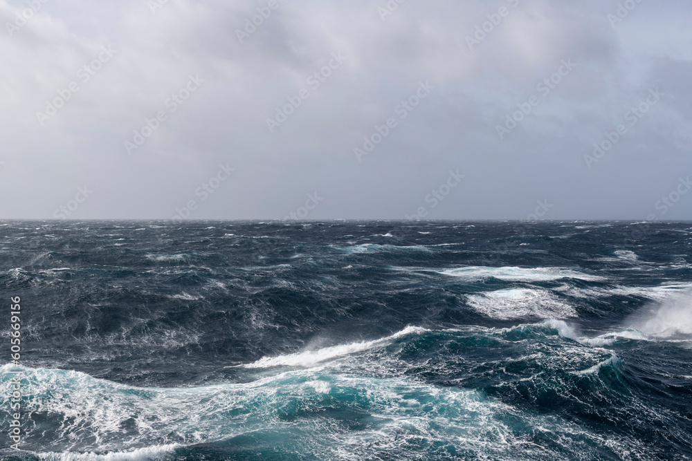 Beautiful seascape - waves and sky with clouds with beautiful lighting. Stormy sea, Bad weather. Gale. Rough sea.