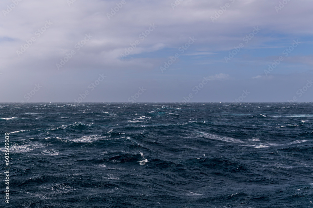 Beautiful seascape - waves and sky with clouds with beautiful lighting. Stormy sea, Bad weather. Gale. Rough sea. Beautiful seascape - waves and sky with clouds with beautiful lighting. Stormy sea, Bad weather. Gale. Rough sea.