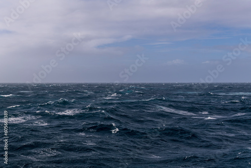 Beautiful seascape - waves and sky with clouds with beautiful lighting. Stormy sea, Bad weather. Gale. Rough sea.