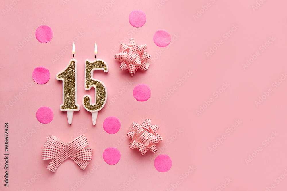 Number 15 on pastel pink background with festive decor. Happy birthday candles. The concept of celebrating a birthday, anniversary, important date, holiday. Copy space. Banner Number 15 on pastel pink background with festive decor. Happy birthday candles. The concept of celebrating a birthday, anniversary, important date, holiday. Copy space. Banner