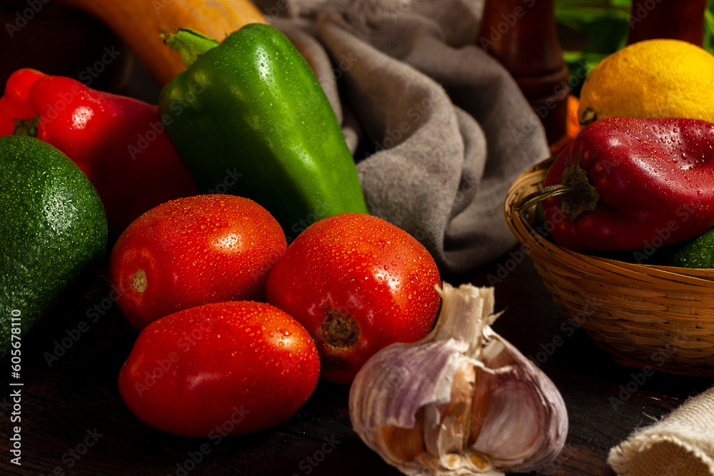 Φωτογραφία still life photo of various vegetables on a wooden table with vegetables in a wicker basket with oil and pepper shakers