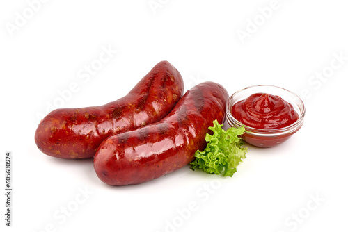 German grilled pork sausages, close-up, isolated on white background.