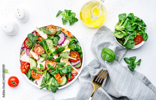 Fotografija Healthy fresh salad with grilled chicken slice with cherry tomatoes, cucumber, r