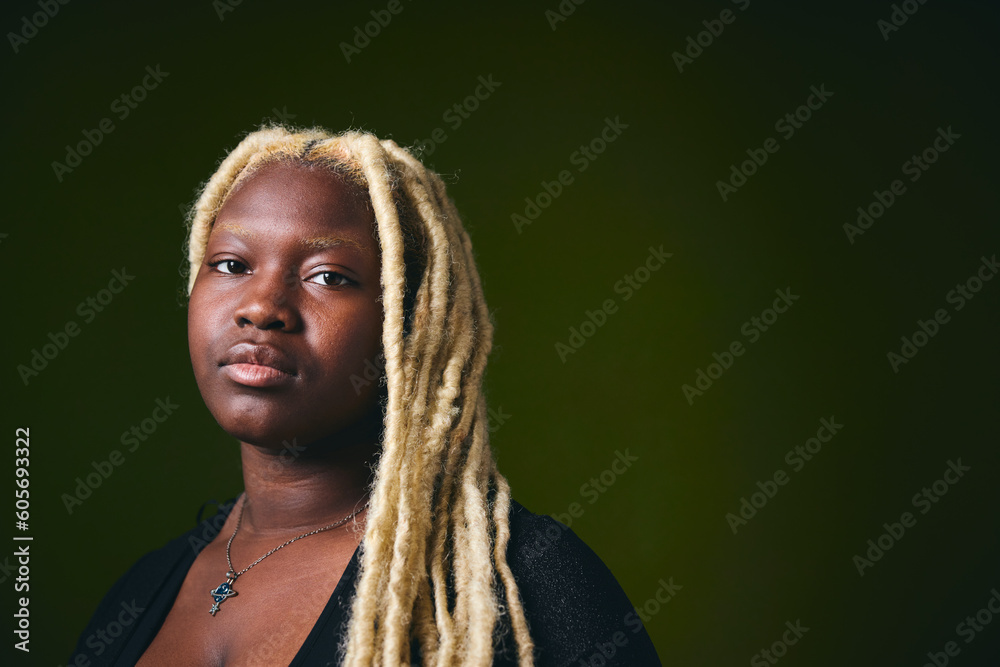 Portrait of black lesbian woman with blonde braids looking towards camera Portrait of black lesbian woman with blonde braids looking towards camera