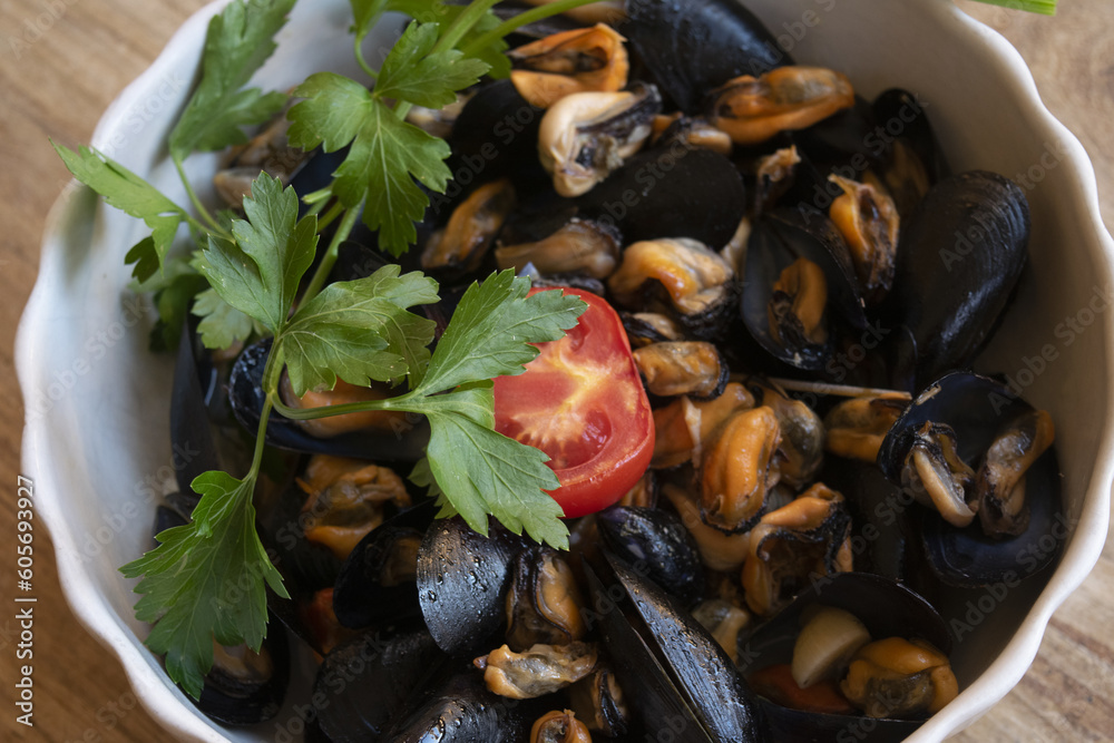 mussel soup with parsley and tomato
