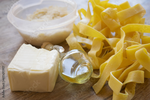 handnade fettuccine and ingredients to prepare pasta alla alfredo