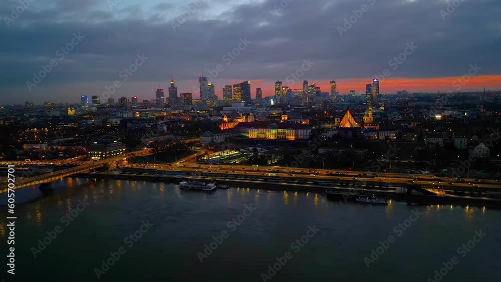 Night Warsaw's Old Town viewed from the royal castle at a height. Beautiful architecture and city lights in Poland. Modern downtown financial center view after sunset, dusk cityscape, skyline. Aerial Night Warsaw's Old Town viewed from the royal castle at a height. Beautiful architecture and city lights in Poland. Modern downtown financial center view after sunset, dusk cityscape, skyline. Aerial