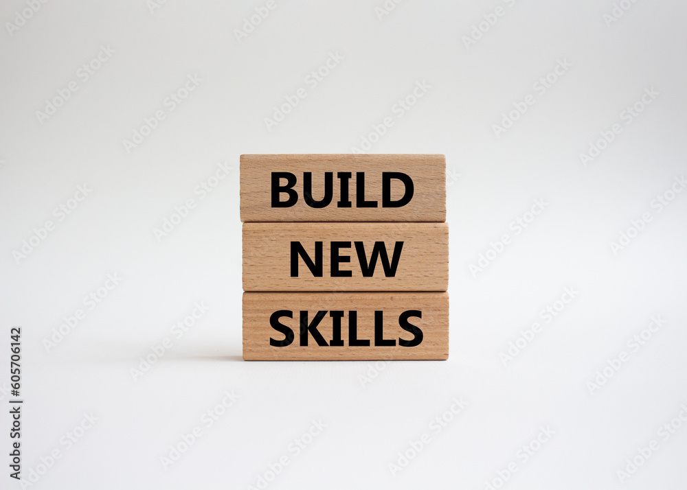Build New skills symbol. Concept word Build New skills on wooden blocks. Beautiful white background. Business and Build New skills concept. Copy space