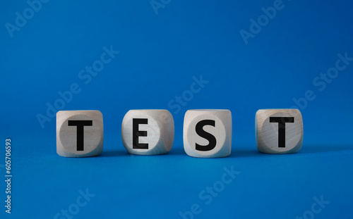 Test symbol. Concept word Test on wooden cubes. Beautiful blue background. Business and Test concept. Copy space.