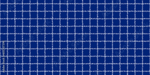 Windowpane plaid blue and white seamless pattern with sketchy lines. Wool suit fabric. Elegant masculine design. Simple monochrome background. Twill variegated woolen material