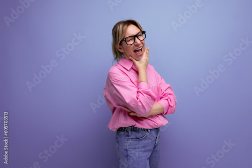 30 year old pretty smart caucasian blond leader careerist woman with ponytail with glasses dressed in casual pink shirt