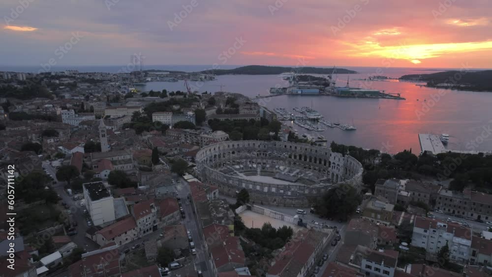 Aerial panoramic drone view of famous european city of Pula Marina and Roman Arena (Amphitheatre) of roman time at sunset, Pula, Istria County, Adriatic, UNESCO world heritage site. Aerial panoramic drone view of famous european city of Pula Marina and Roman Arena (Amphitheatre) of roman time at sunset, Pula, Istria County, Adriatic, UNESCO world heritage site.