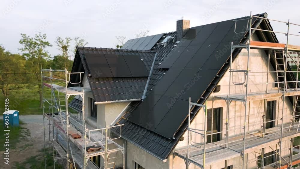 Construction site of a sustainable single family house with solar panels Construction site of a sustainable single family house with solar panels