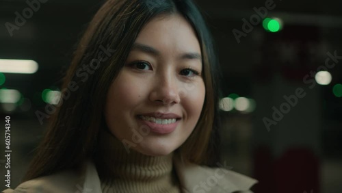 Close up portrait Asian chinese korean japanese ethnic woman toothy smile looking at camera female businesswoman lady executive manager in car parking outside happy satisfied girl smiling healthcare photo