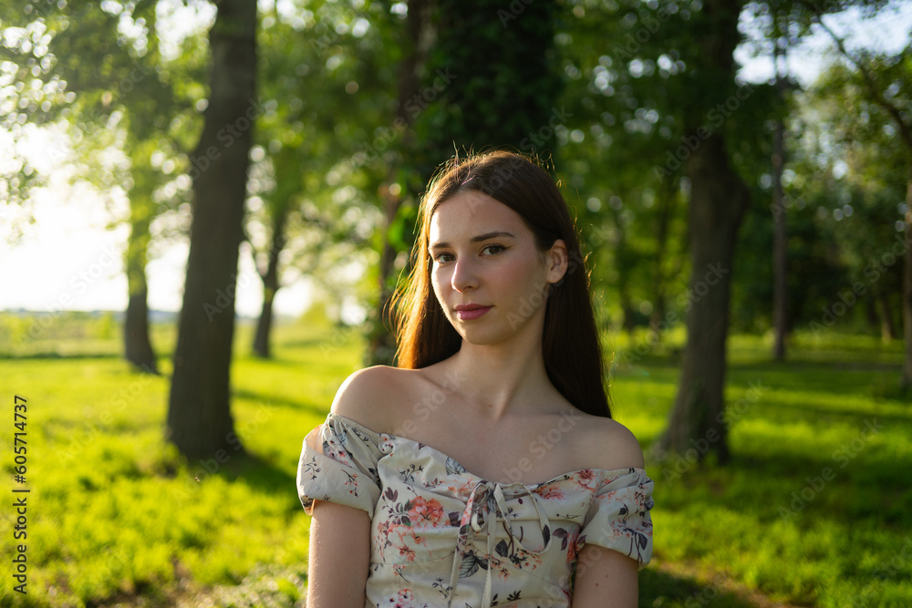 Beautiful Young Happy Woman Enjoying the Sunlight in a Public Park Beautiful Young Happy Woman Enjoying the Sunlight in a Public Park