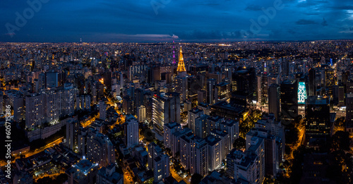 Aerial view of an antenna, surrounded by buildings at dusk in the city of São Paulo