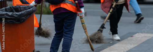 Fényképezés City cleaner dragging a trash can