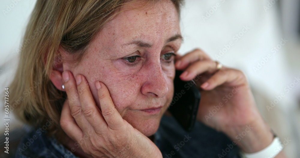 Senior retired woman speaking on phone candid Senior retired woman speaking on phone candid