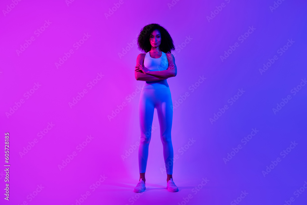 Full length photo of slim great shape self improvement coach folded arms posing isolated on blue pink color neon background