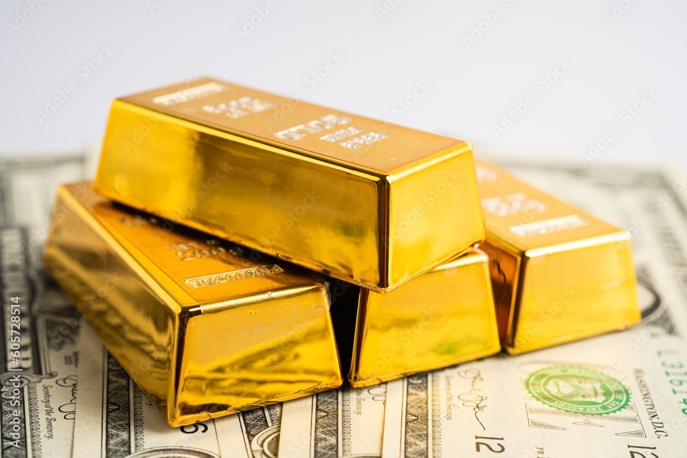Gold bar on US dollar banknotes money, economy finance exchange trade investment concept. Gold bar on US dollar banknotes money, economy finance exchange trade investment concept.