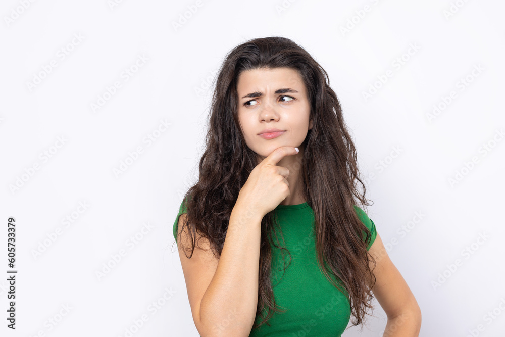 Portrait of a beautiful young woman thinking, isolated on white background