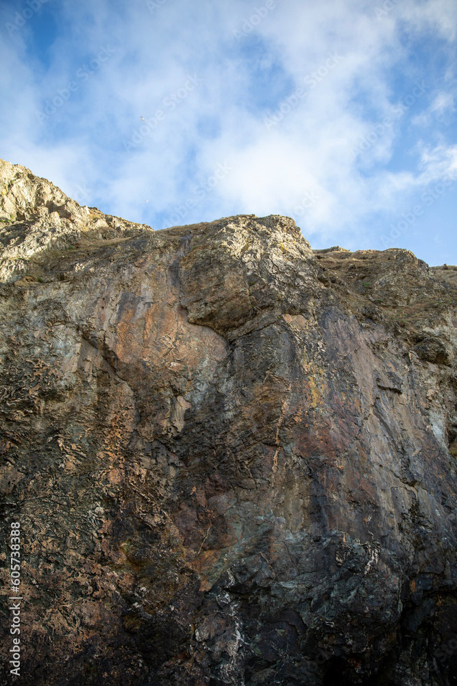 Surreal and beautiful cliffs at Perranporth Beach during low tide.