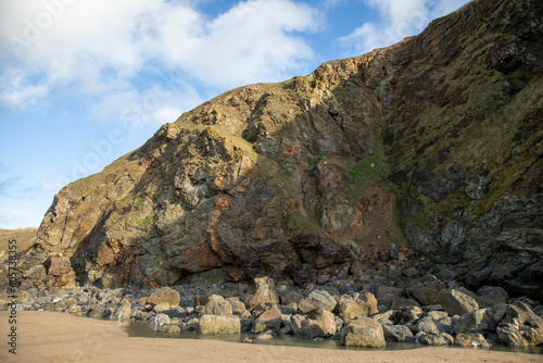 Surreal and beautiful cliffs at Perranporth Beach during low tide.