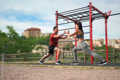 Couple doing sport together in a park of a town
