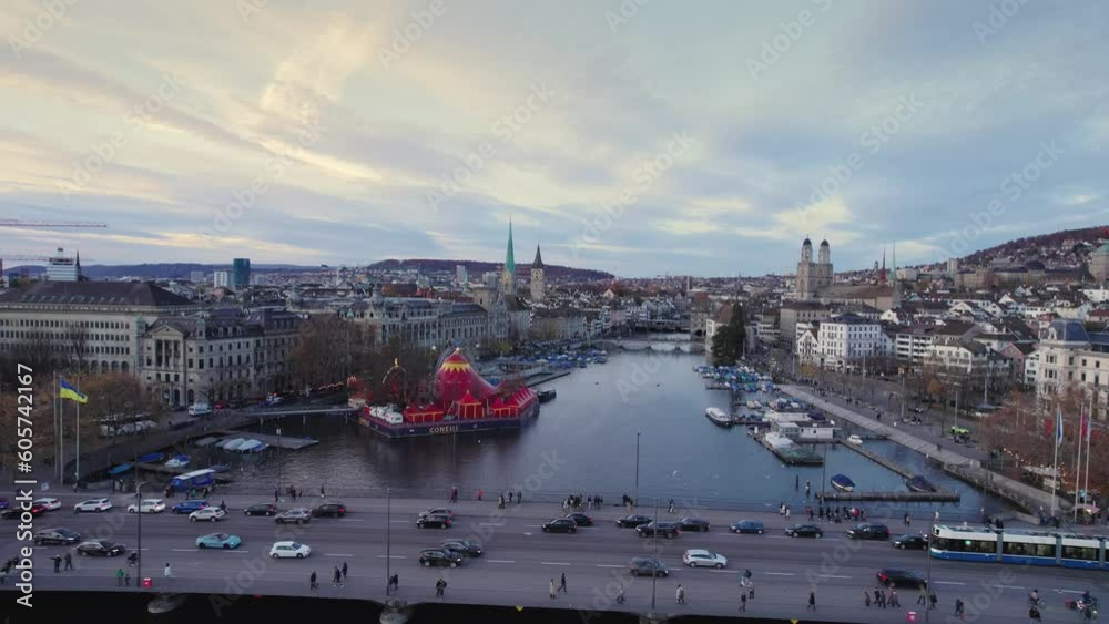 Aerial panoramic drone view of historic city center with famous Fraumunster Church and River Limmat, from Grossmunster Church at sunset with clouds in autumn, Zurich, Canton of Zurich, Switzerland Aerial panoramic drone view of historic city center with famous Fraumunster Church and River Limmat, from Grossmunster Church at sunset with clouds in autumn, Zurich, Canton of Zurich, Switzerland