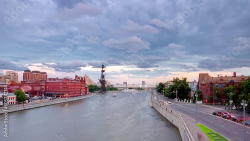 View from the Patriarch bridge to the river panorama of Moscow day to night transition aerial timelapse. Traffic on the road near waterfront