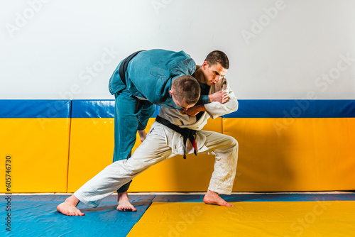 Brazilian jiu-jitsu and grappling training for men in a self-defense gym photo