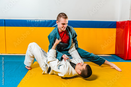 Obraz na plátně Brazilian jiu-jitsu and grappling training for men in a self-defense gym