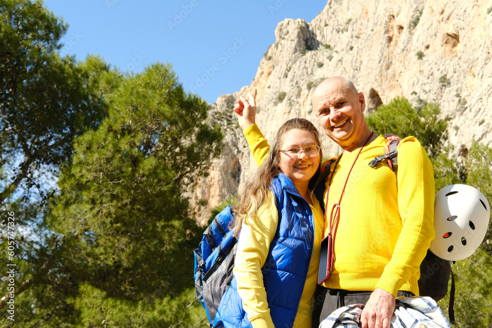 adult couple, mature man, woman, backpackers hiking along rocky mountain path, enjoys beauty nature, extreme active lifestyle of people, concept together travel, summer vacation, unlimited freedom