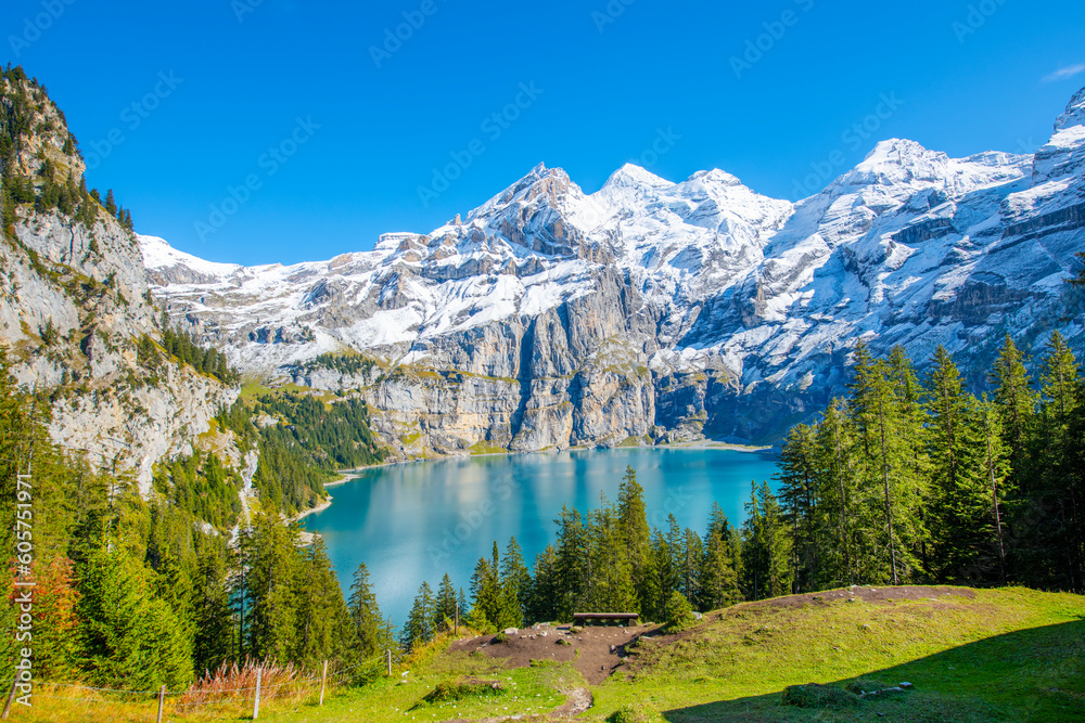 Amazing tourquise Oeschinnensee with waterfalls and Swiss Alps, Kandersteg, Berner Oberland, Switzerland.