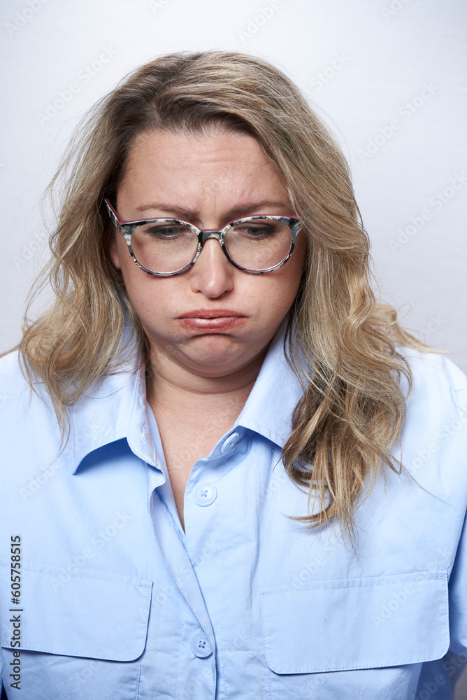 Adult woman in glasses with nausea, on a white background