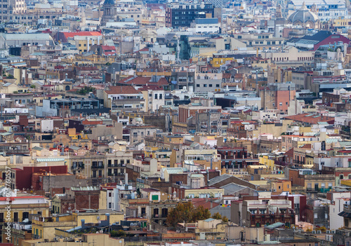 Aerial panoramic view of Barcelona, Spain. Cityscape with buildings background, top view on the old town from birds eye. Houses and rooftops of Barcelona, urban background of city roofs, top view.