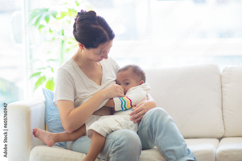 Mother nursing baby at home. Breastfeeding infant. Mother nursing baby at home. Breastfeeding infant.