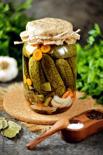 Homemade pickled cucumbers with carrot, and onions.
