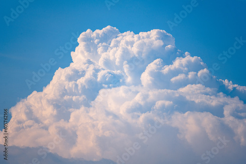 Clouds in the blue sky. Natural background with a space for title or description. © Szymon Bartosz